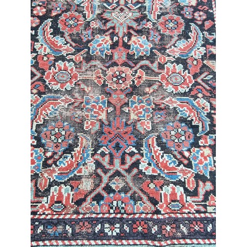 1000 - A large Persian runner, having floral central medallion, (a.f.), 490 x 94cm; together with a small C... 