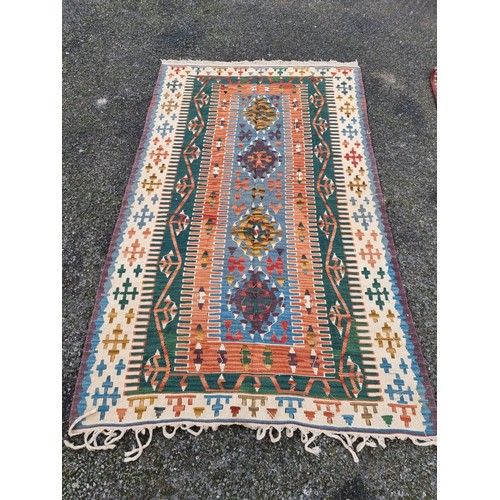 1003 - A Kelim rug, having geometric borders, 226 x 140cm.