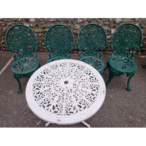 1148 - A white painted aluminium table, 64cm high x 69cm wide; together with a set of four green painted ch... 