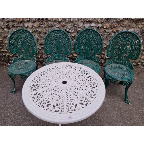 1149 - A white painted aluminium table, 64cm high x 69cm wide; together with a set of four green painted ch... 