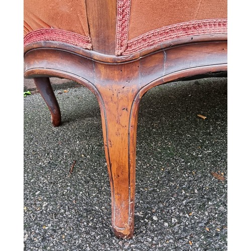 1090 - A Victorian carved walnut and button upholstered settee, (faults).