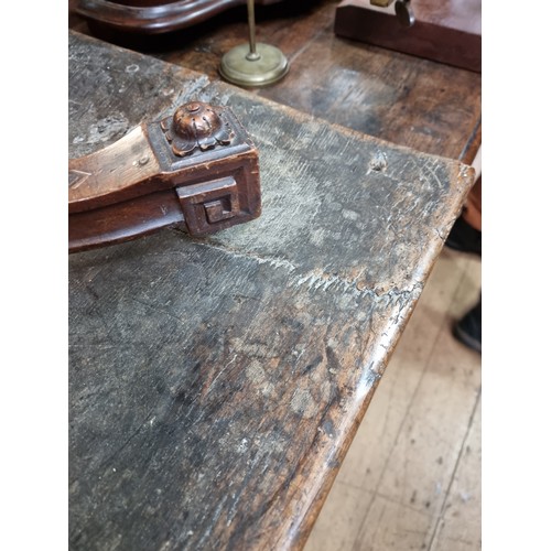 1060 - A 17th century oak panelled coffer, 135.5cm wide, (later panels to the front).