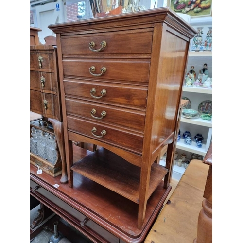 1037 - An Edwardian mahogany music cabinet, 53cm wide. 