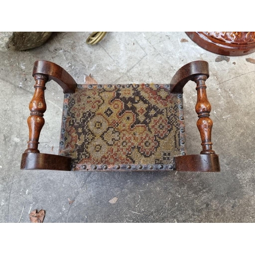 1059 - An early 20th century oak gout stool, on brass feet, 31.5cm wide.  