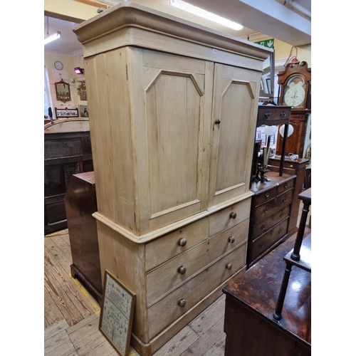 1082 - A 19th century pine linen press, enclosing four sliding trays, 130cm wide. 