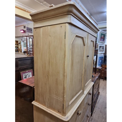 1082 - A 19th century pine linen press, enclosing four sliding trays, 130cm wide. 