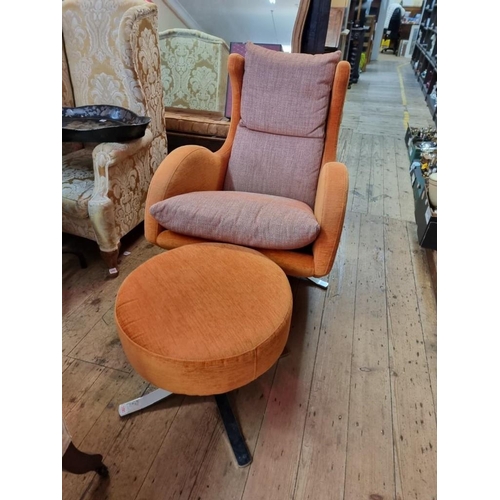 1091 - A Fama 'Lenny' swivel armchair and matching stool.