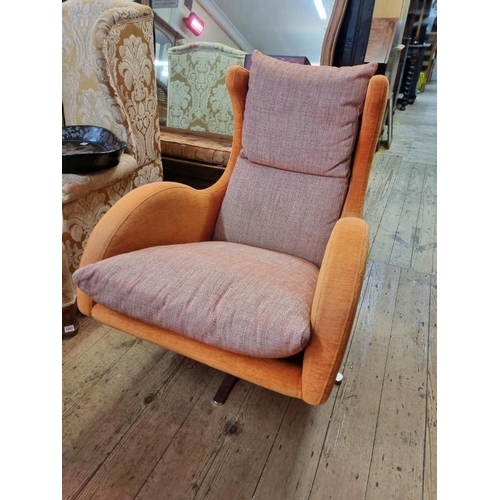 1091 - A Fama 'Lenny' swivel armchair and matching stool.