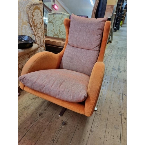 1091 - A Fama 'Lenny' swivel armchair and matching stool.