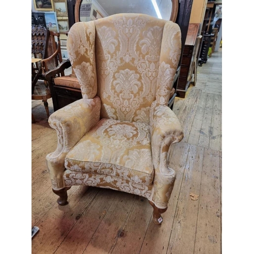 1092 - An 18th century style yellow damask wing armchair. 