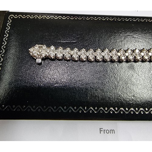 523 - A diamond bracelet, set one hundred and thirty eight brilliant cut diamonds, totalling approximately... 