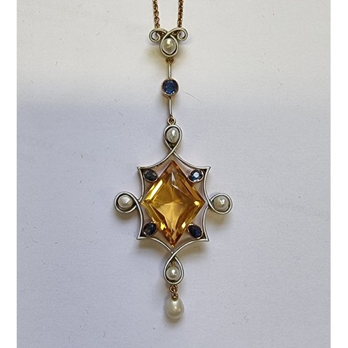 525 - A yellow metal and white enamel pendant, set central star shaped faceted citrine with sapphires and ...