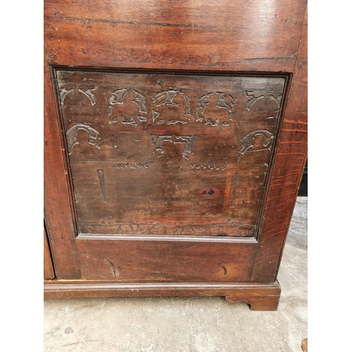 1020 - An 18th century oak press cupboard, incorporating 17th century Italian Cypress wood panels, 164cm wi... 