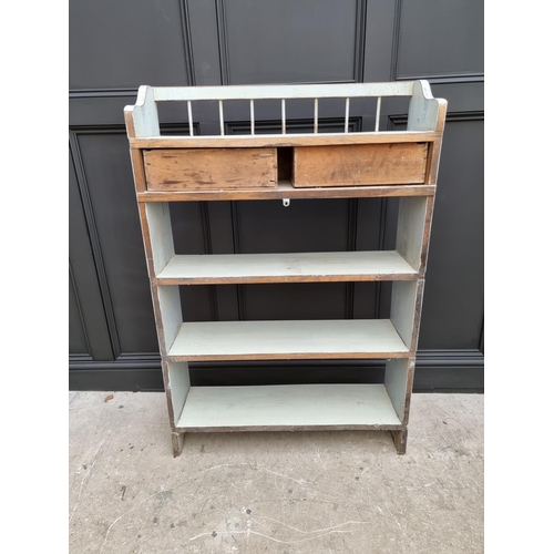 1021 - An old blue painted open bookcase, 130cm high x 87cm wide. 