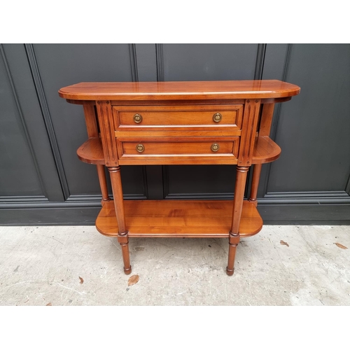 1022 - A reproduction cherry wood console table, labelled 'Anne de Morienne', 89cm wide. ... 