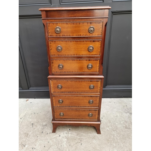 1028 - A small reproduction mahogany chest on chest, 48cm wide. 