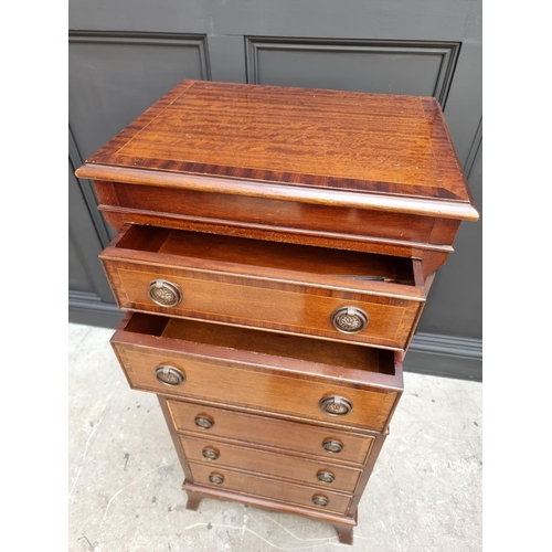 1028 - A small reproduction mahogany chest on chest, 48cm wide. 