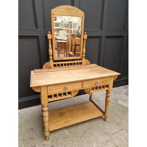 1030 - An antique pine mirror back dressing table, 107.5cm wide. 