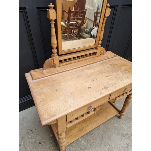 1030 - An antique pine mirror back dressing table, 107.5cm wide. 