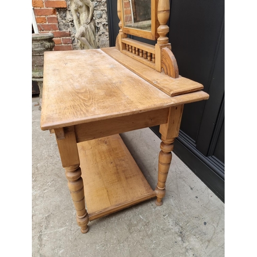 1030 - An antique pine mirror back dressing table, 107.5cm wide. 