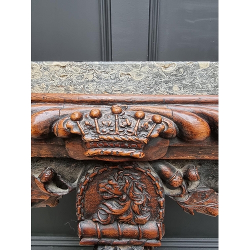 1036 - An interesting 19th century carved oak console table, with green marble top above a gadrooned frieze... 