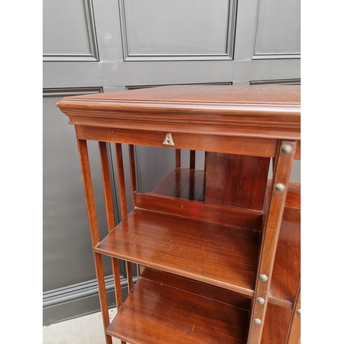 1037 - A large circa 1900 mahogany revolving bookcase, 120.5cm high x 59cm wide.