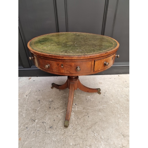 1041 - A small George III and later mahogany drum top library table, with leather inset surface above ... 