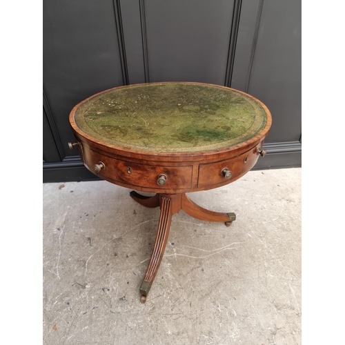 1041 - A small George III and later mahogany drum top library table, with leather inset surface above ... 