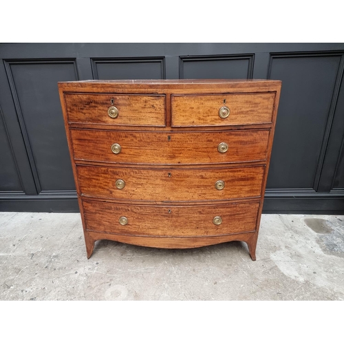 1043 - A George III mahogany and line inlaid bowfront chest of drawers, 105cm wide. 