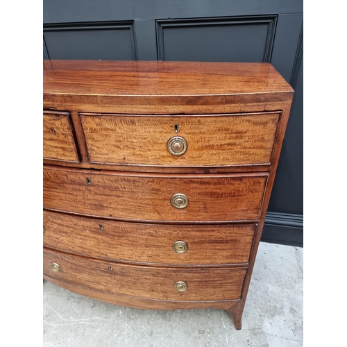 1043 - A George III mahogany and line inlaid bowfront chest of drawers, 105cm wide. 