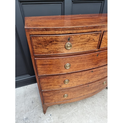 1043 - A George III mahogany and line inlaid bowfront chest of drawers, 105cm wide. 