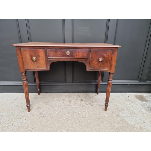 1044 - An early 19th century mahogany concave fronted table, in the manner of Gillows, 104.5cm wide. ... 