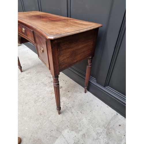 1044 - An early 19th century mahogany concave fronted table, in the manner of Gillows, 104.5cm wide. ... 