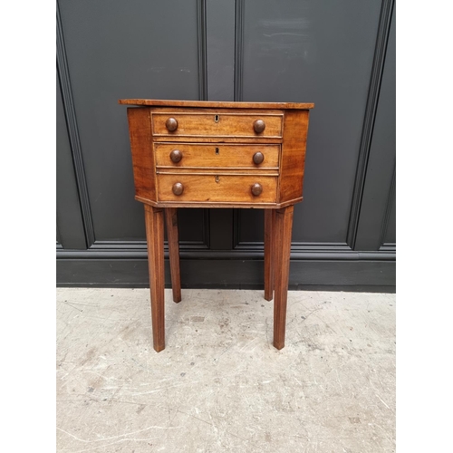 1045 - An early 19th century mahogany octagonal work table, with hinged top and frieze drawer, 49cm wide.&n... 