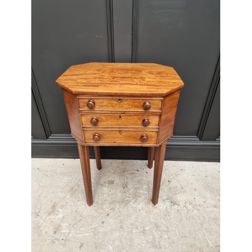 1045 - An early 19th century mahogany octagonal work table, with hinged top and frieze drawer, 49cm wide.&n... 