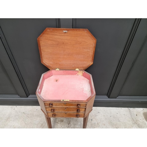 1045 - An early 19th century mahogany octagonal work table, with hinged top and frieze drawer, 49cm wide.&n... 