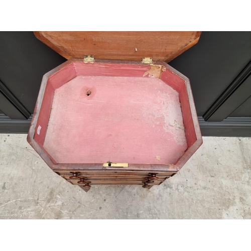 1045 - An early 19th century mahogany octagonal work table, with hinged top and frieze drawer, 49cm wide.&n... 