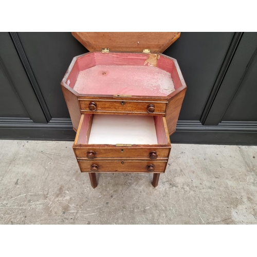 1045 - An early 19th century mahogany octagonal work table, with hinged top and frieze drawer, 49cm wide.&n... 