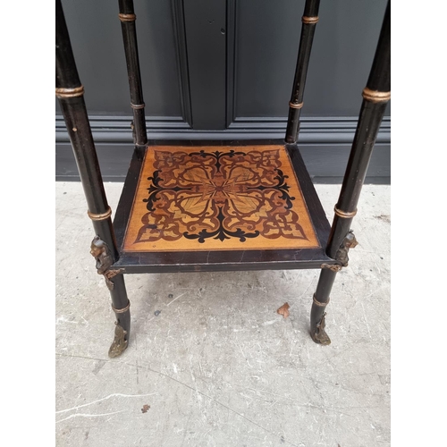 1056 - An unusual late 19th century Egyptian revival ebonized and inlaid occasional table, the top inset wi... 