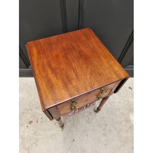 1057 - An early 19th century mahogany Pembroke work table, 47cm wide. 