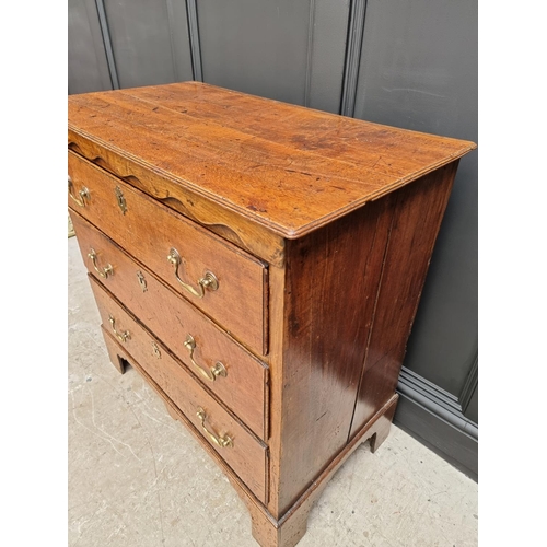 1058 - An 18th century oak three drawer chest, with moulded frieze, 89.5cm wide. 