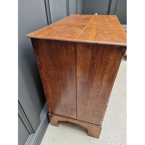 1058 - An 18th century oak three drawer chest, with moulded frieze, 89.5cm wide. 