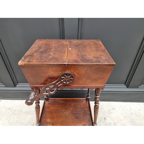 1061 - An antique mahogany work box on stand, 43cm wide at base. 