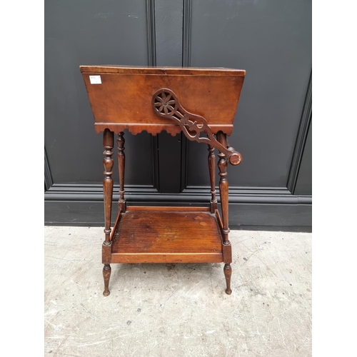 1061 - An antique mahogany work box on stand, 43cm wide at base. 