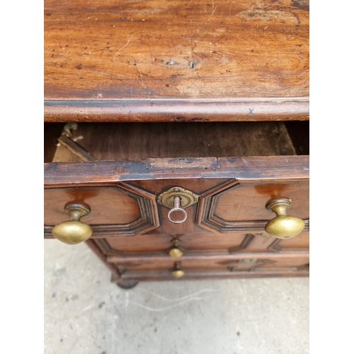 1063 - A rare late 17th century solid walnut geometrically moulded chest of drawers, on bun feet, 98.5cm wi... 