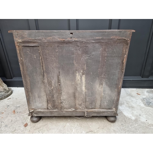 1063 - A rare late 17th century solid walnut geometrically moulded chest of drawers, on bun feet, 98.5cm wi... 