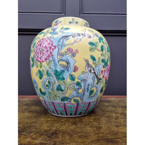 1432 - A large Chinese famille rose yellow ground jar, 33cm high.