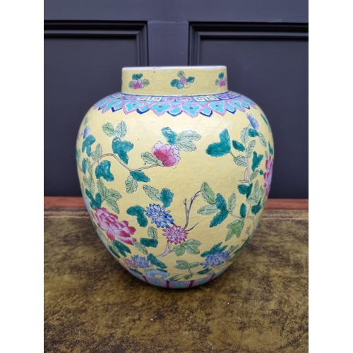 1432 - A large Chinese famille rose yellow ground jar, 33cm high.