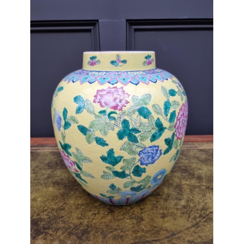 1432 - A large Chinese famille rose yellow ground jar, 33cm high.