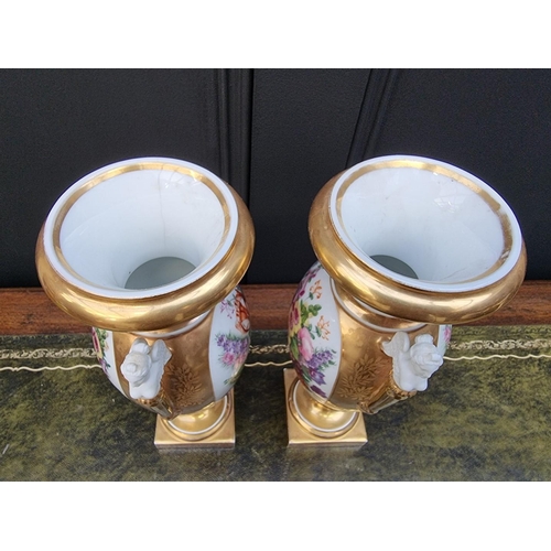 1453 - A pair of 19th century Continental porcelain twin handled vases, 29.5cm high, (s.d. to one).... 